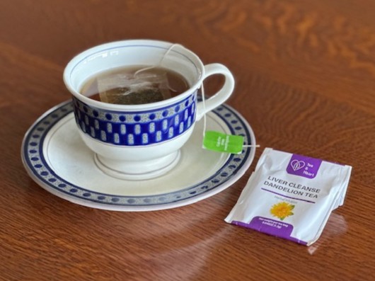 A cup of dandelion tea that is rich in inulin and bitter compounds that support liver and digestive health.